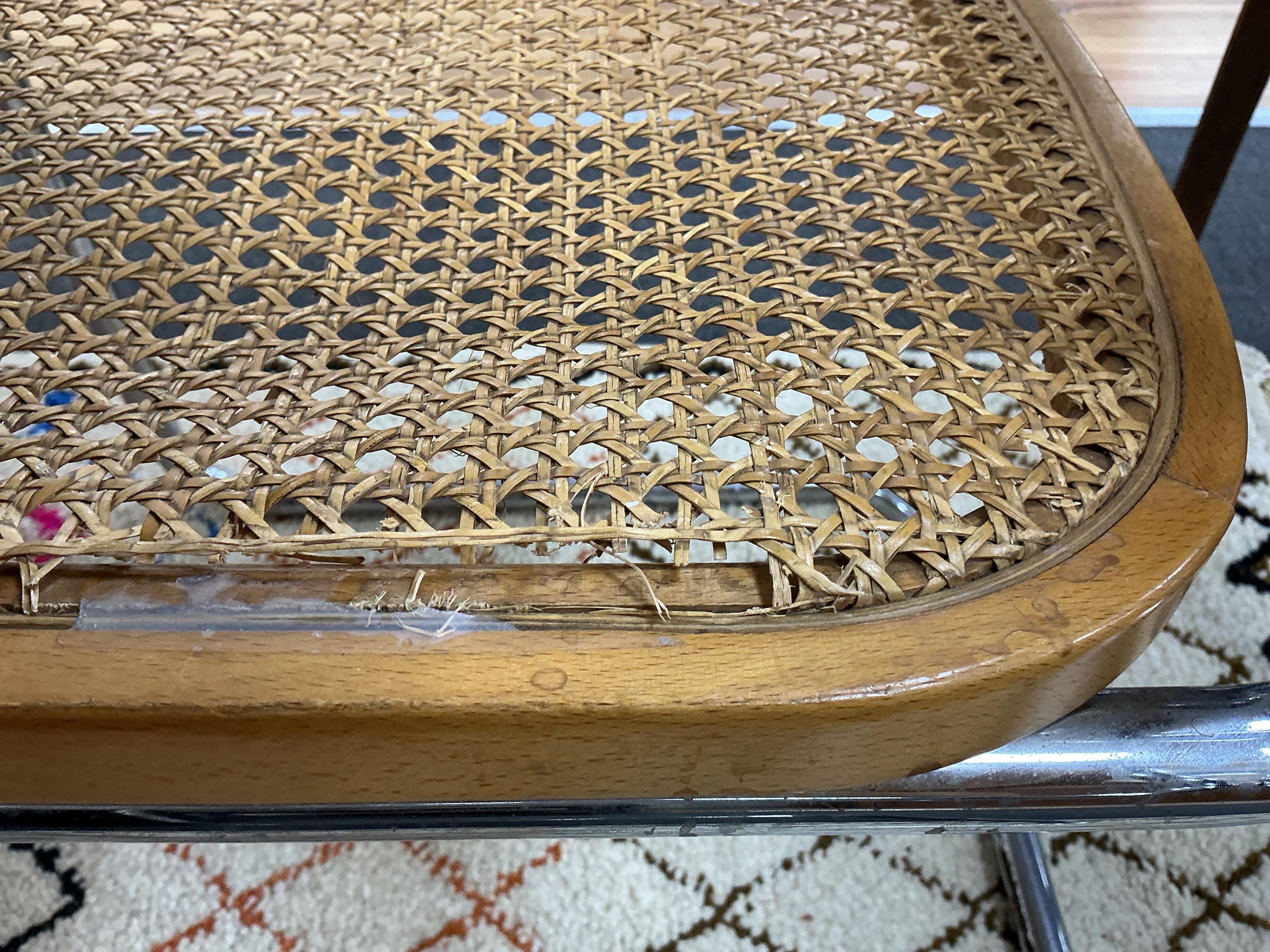 After Marcel Breuer a Cesca style circular table, diameter 112cm, height 72cm and four caned cantilever chairs, possibly Habitat.